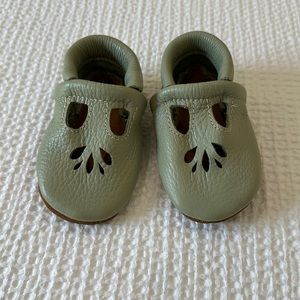 Size 6 toddler faux leather moccasins in sage green.